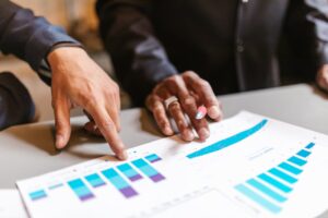 Business professionals analyzing charts and graphs during a meeting.